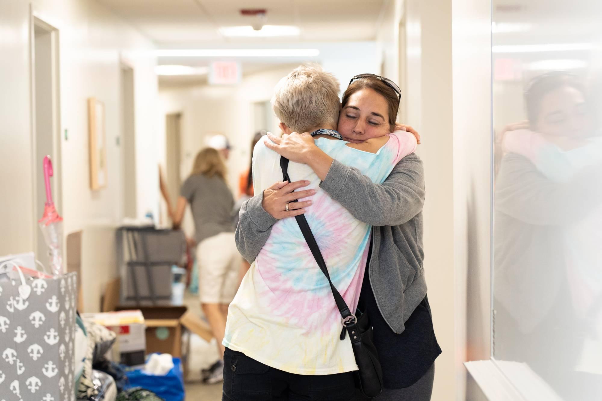 parent and student hugging